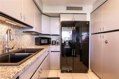 Experience elevated living in this 9th-floor high-rise unit on Las Vegas Country Club in Nevada - for sale on GolfHomes.com, golf home, golf lot