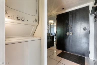 Experience elevated living in this 9th-floor high-rise unit on Las Vegas Country Club in Nevada - for sale on GolfHomes.com, golf home, golf lot