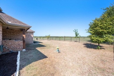 Escape to this well maintained residence nestled in a stunning on The Retreat in Texas - for sale on GolfHomes.com, golf home, golf lot