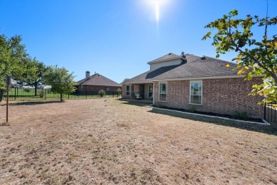 Escape to this well maintained residence nestled in a stunning on The Retreat in Texas - for sale on GolfHomes.com, golf home, golf lot