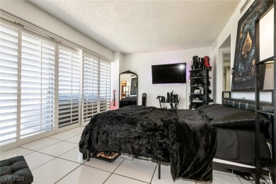 Experience elevated living in this 9th-floor high-rise unit on Las Vegas Country Club in Nevada - for sale on GolfHomes.com, golf home, golf lot