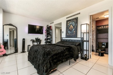 Experience elevated living in this 9th-floor high-rise unit on Las Vegas Country Club in Nevada - for sale on GolfHomes.com, golf home, golf lot