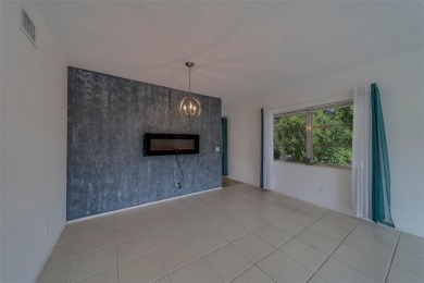 Light, bright and impeccably updated! This 3rd floor corner unit on On Top Of The World Golf Course in Florida - for sale on GolfHomes.com, golf home, golf lot