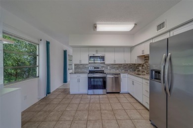 Light, bright and impeccably updated! This 3rd floor corner unit on On Top Of The World Golf Course in Florida - for sale on GolfHomes.com, golf home, golf lot