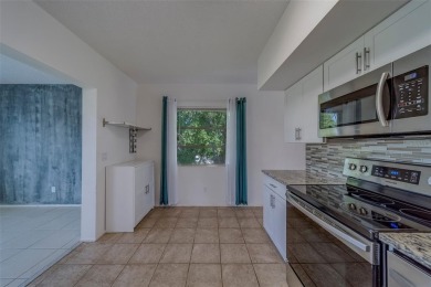 Light, bright and impeccably updated! This 3rd floor corner unit on On Top Of The World Golf Course in Florida - for sale on GolfHomes.com, golf home, golf lot