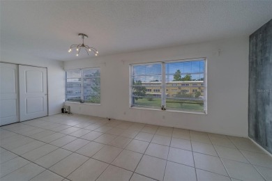 Light, bright and impeccably updated! This 3rd floor corner unit on On Top Of The World Golf Course in Florida - for sale on GolfHomes.com, golf home, golf lot