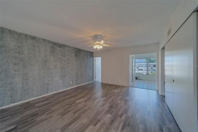 Light, bright and impeccably updated! This 3rd floor corner unit on On Top Of The World Golf Course in Florida - for sale on GolfHomes.com, golf home, golf lot