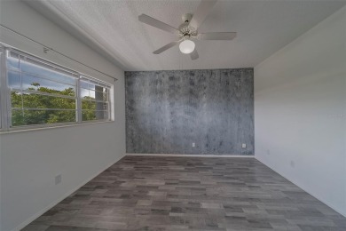 Light, bright and impeccably updated! This 3rd floor corner unit on On Top Of The World Golf Course in Florida - for sale on GolfHomes.com, golf home, golf lot