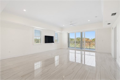 TASTEFULLY RENOVATED TOP FLOOR CORNER CONDO IN MAYFAIR HOUSE on Oak Harbor Country Club in Florida - for sale on GolfHomes.com, golf home, golf lot