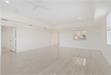 TASTEFULLY RENOVATED TOP FLOOR CORNER CONDO IN MAYFAIR HOUSE on Oak Harbor Country Club in Florida - for sale on GolfHomes.com, golf home, golf lot