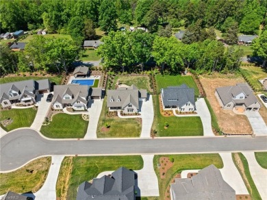 Welcome! Where comfort, charm, and thoughtful design come on Meadowlands Golf Club in North Carolina - for sale on GolfHomes.com, golf home, golf lot