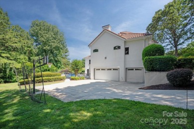 Mediterranean elegance meets luxury living in this stately on TPC at Piper Glen in North Carolina - for sale on GolfHomes.com, golf home, golf lot