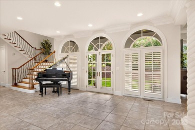 Mediterranean elegance meets luxury living in this stately on TPC at Piper Glen in North Carolina - for sale on GolfHomes.com, golf home, golf lot