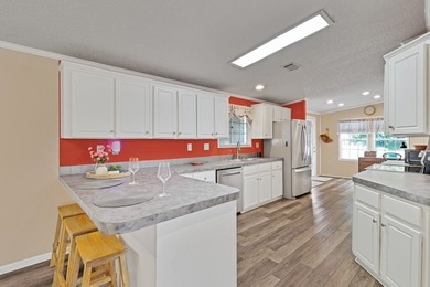 Beautifully maintained 2005 furnished home on a spacious lot. 1 on Barefoot Bay Golf Course in Florida - for sale on GolfHomes.com, golf home, golf lot