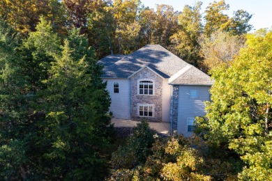 Elegant and expansive 5-bedroom, 3-bathroom home nestled in the on Ledgestone Country Club and Golf Course in Missouri - for sale on GolfHomes.com, golf home, golf lot