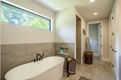 Recently built in 2023, this custom ranch home offers 5 bedrooms on Dakota Dunes Country Club in South Dakota - for sale on GolfHomes.com, golf home, golf lot