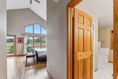 Pair mountain vistas with golf course tranquility in this on Keystone Ranch Golf Course in Colorado - for sale on GolfHomes.com, golf home, golf lot