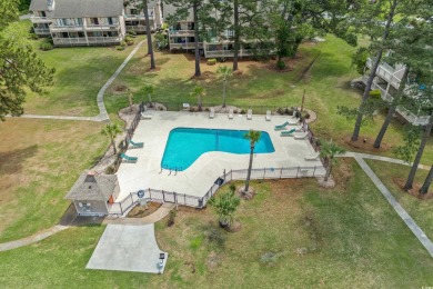 Discover your perfect getaway in this delightful first-floor on Myrtlewood Golf Course and Club  in South Carolina - for sale on GolfHomes.com, golf home, golf lot