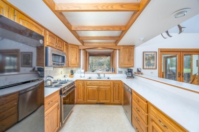 Don't miss this charming 3-Bedroom, 2-Bathroom Home with on Canadian Lakes Country Club-The Royal Course in Michigan - for sale on GolfHomes.com, golf home, golf lot