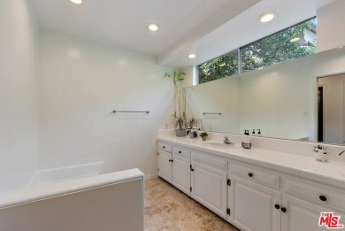Welcome to your dream retreat in the picturesque Woodland Hills on Woodland Hills Country Club in California - for sale on GolfHomes.com, golf home, golf lot