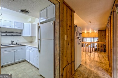 Newly carpeted,  open floor plan, large dining & living room on Kingwood Golf Club and Resort in Georgia - for sale on GolfHomes.com, golf home, golf lot