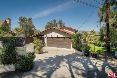 Welcome to your dream retreat in the picturesque Woodland Hills on Woodland Hills Country Club in California - for sale on GolfHomes.com, golf home, golf lot