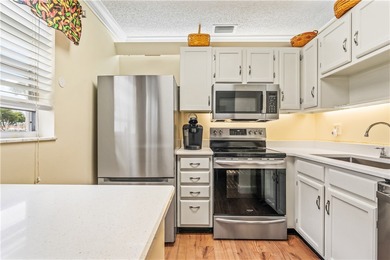 Enjoy easy Florida living in this 2BR/2BA FIRST-FLOOR unit with on The American Golf Club in Florida - for sale on GolfHomes.com, golf home, golf lot