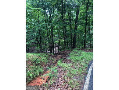 Build your dream home on this 0.78-acre buildable lot in the on Big Canoe Golf Club - Cherokee in Georgia - for sale on GolfHomes.com, golf home, golf lot