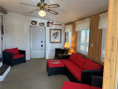 *Home Sweet Home*.Custom painted driveway flows into carport on Barefoot Bay Golf Course in Florida - for sale on GolfHomes.com, golf home, golf lot