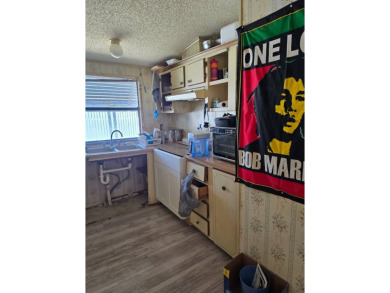 This home is located in the 55+ mobile home community of Anglers on Anglers Green Golf Course in Florida - for sale on GolfHomes.com, golf home, golf lot