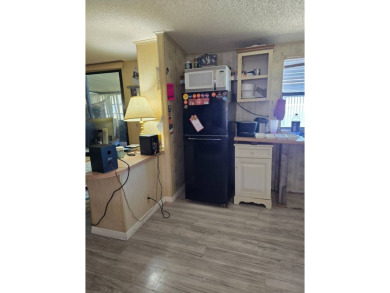 This home is located in the 55+ mobile home community of Anglers on Anglers Green Golf Course in Florida - for sale on GolfHomes.com, golf home, golf lot