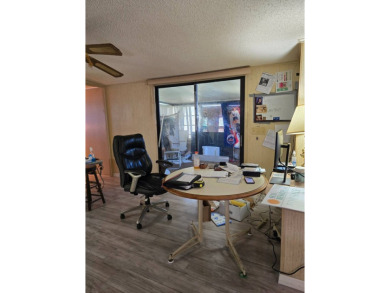 This home is located in the 55+ mobile home community of Anglers on Anglers Green Golf Course in Florida - for sale on GolfHomes.com, golf home, golf lot