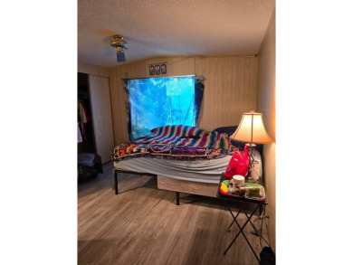 This home is located in the 55+ mobile home community of Anglers on Anglers Green Golf Course in Florida - for sale on GolfHomes.com, golf home, golf lot