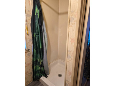 This home is located in the 55+ mobile home community of Anglers on Anglers Green Golf Course in Florida - for sale on GolfHomes.com, golf home, golf lot