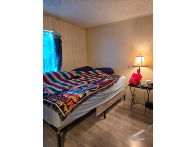 This home is located in the 55+ mobile home community of Anglers on Anglers Green Golf Course in Florida - for sale on GolfHomes.com, golf home, golf lot