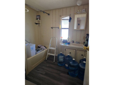 This home is located in the 55+ mobile home community of Anglers on Anglers Green Golf Course in Florida - for sale on GolfHomes.com, golf home, golf lot