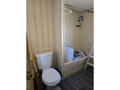 This home is located in the 55+ mobile home community of Anglers on Anglers Green Golf Course in Florida - for sale on GolfHomes.com, golf home, golf lot
