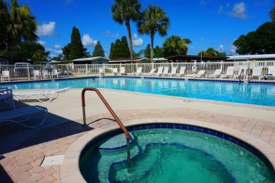 This home is located in the 55+ mobile home community of Anglers on Anglers Green Golf Course in Florida - for sale on GolfHomes.com, golf home, golf lot