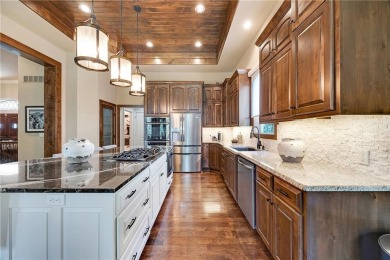 Luxury home in the gated community of Loch Lloyd.  Meticulously on Loch Lloyd Country Club in Missouri - for sale on GolfHomes.com, golf home, golf lot