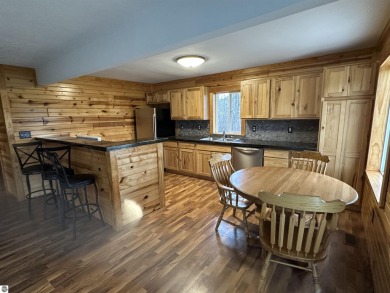 Very nicely updated story and a half home overlooking the Pine on Pine River Golf Club in Michigan - for sale on GolfHomes.com, golf home, golf lot