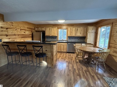 Very nicely updated story and a half home overlooking the Pine on Pine River Golf Club in Michigan - for sale on GolfHomes.com, golf home, golf lot