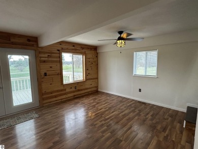 Very nicely updated story and a half home overlooking the Pine on Pine River Golf Club in Michigan - for sale on GolfHomes.com, golf home, golf lot