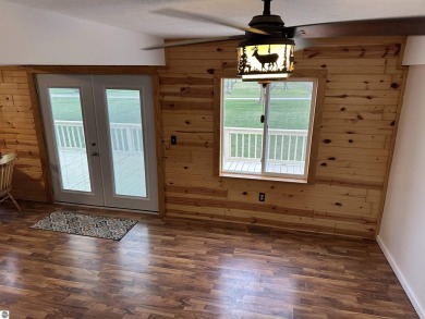 Very nicely updated story and a half home overlooking the Pine on Pine River Golf Club in Michigan - for sale on GolfHomes.com, golf home, golf lot