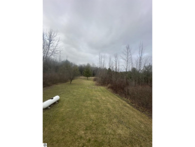 Very nicely updated story and a half home overlooking the Pine on Pine River Golf Club in Michigan - for sale on GolfHomes.com, golf home, golf lot