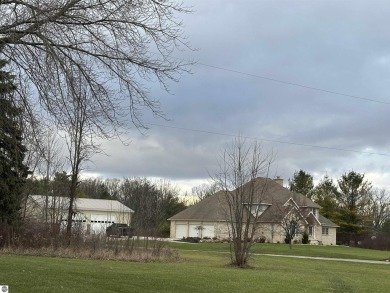 Very nicely updated story and a half home overlooking the Pine on Pine River Golf Club in Michigan - for sale on GolfHomes.com, golf home, golf lot