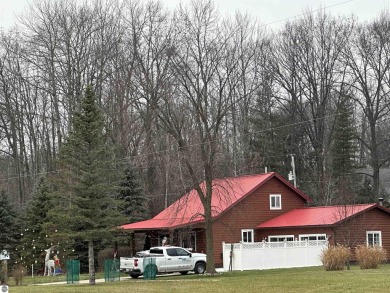 Very nicely updated story and a half home overlooking the Pine on Pine River Golf Club in Michigan - for sale on GolfHomes.com, golf home, golf lot