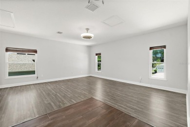 This lovely home is located in the very desirable Cypress Knoll on The Grand Club Cypress Course in Florida - for sale on GolfHomes.com, golf home, golf lot