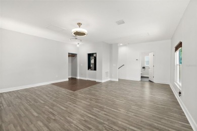 This lovely home is located in the very desirable Cypress Knoll on The Grand Club Cypress Course in Florida - for sale on GolfHomes.com, golf home, golf lot