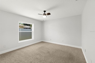 This lovely home is located in the very desirable Cypress Knoll on The Grand Club Cypress Course in Florida - for sale on GolfHomes.com, golf home, golf lot