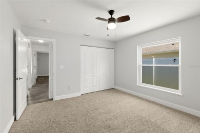 This lovely home is located in the very desirable Cypress Knoll on The Grand Club Cypress Course in Florida - for sale on GolfHomes.com, golf home, golf lot